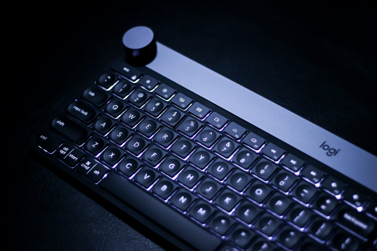 a black keyboard with a small white bottle on top